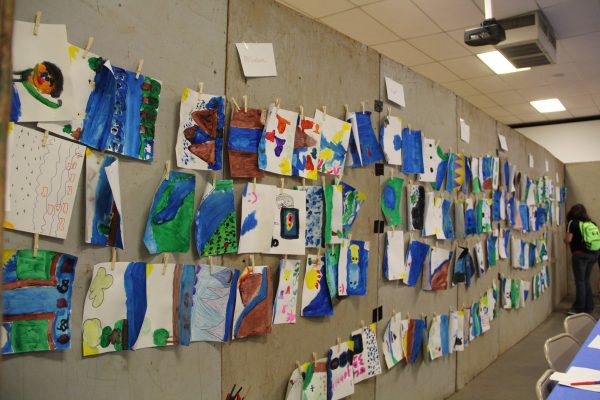 Aquatic Artwork lines the walls of the festival in Dumas. This activity challenges the students to listen to water sounds, think about what water means to them, and then express that through art.